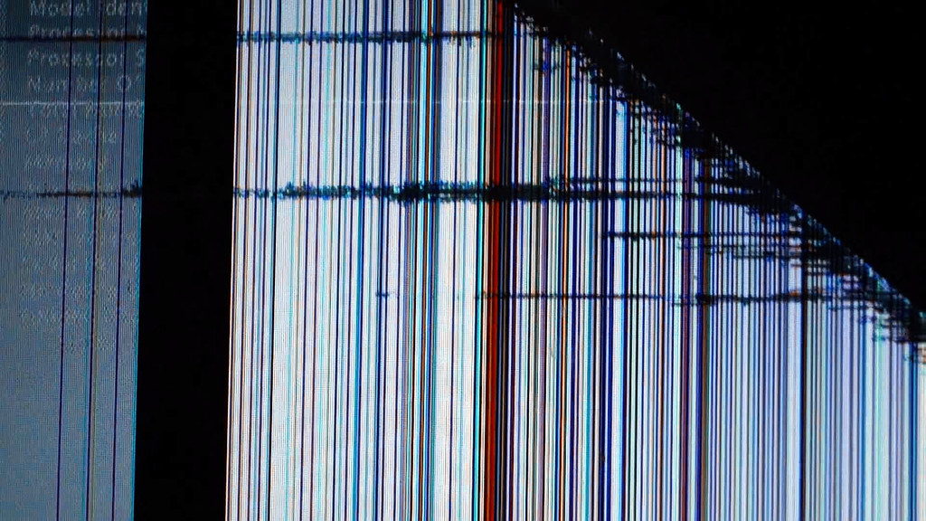 Technician replacing a cracked smartphone screen